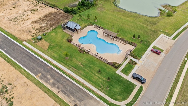 birds eye view of property featuring a water view