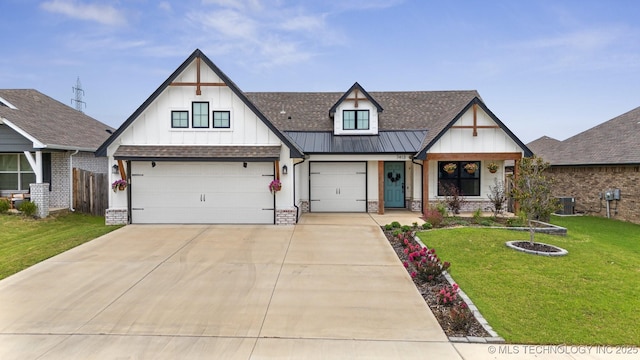 view of front of house with a front lawn, cooling unit, and a garage