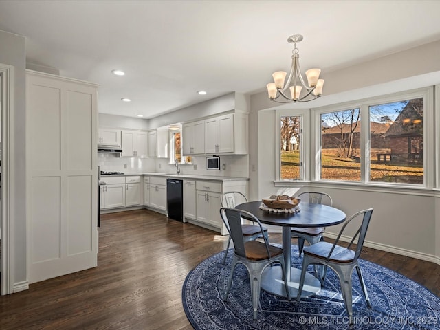 dining room featuring a chandelier and dark hardwood / wood-style flooring