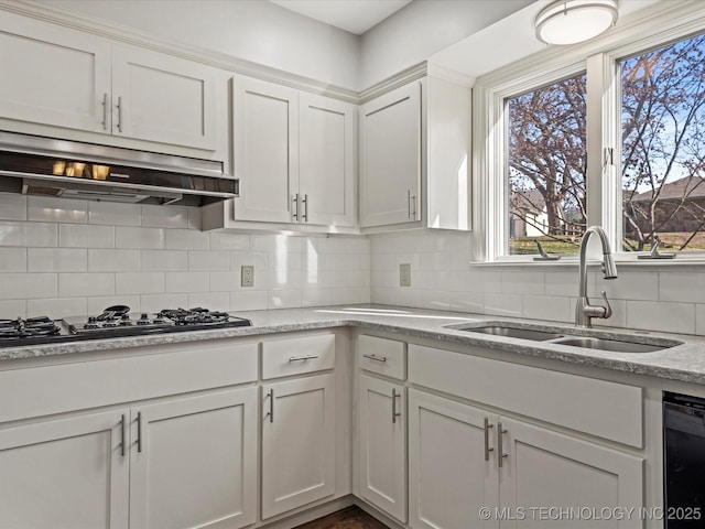 kitchen featuring black appliances, white cabinets, sink, and tasteful backsplash