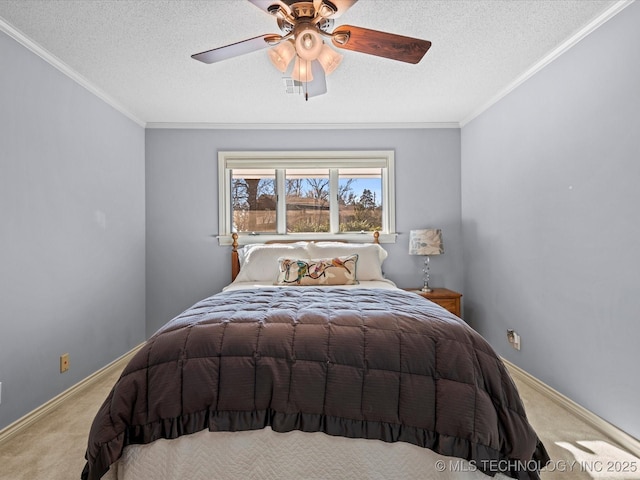 carpeted bedroom featuring ceiling fan, a textured ceiling, and crown molding