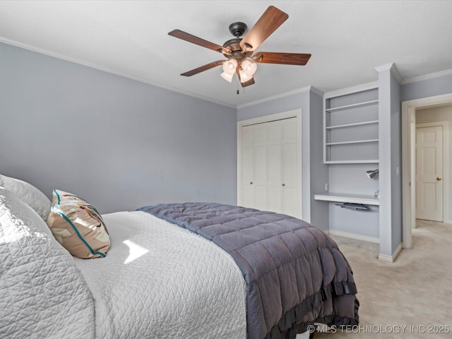 bedroom featuring ceiling fan, a closet, light colored carpet, and crown molding