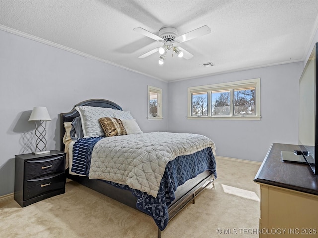 carpeted bedroom featuring ceiling fan, crown molding, and a textured ceiling