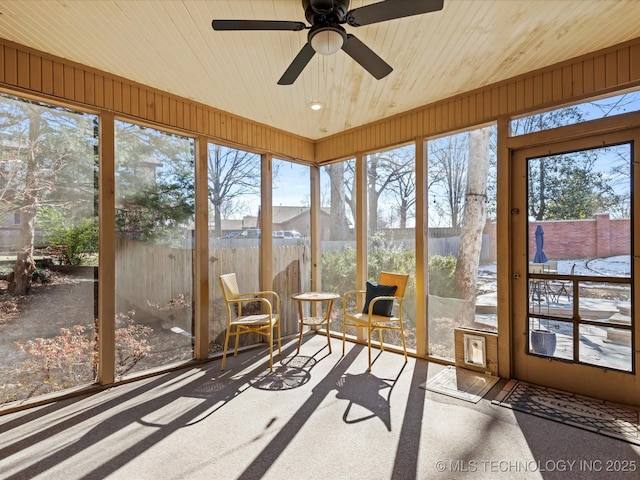 sunroom / solarium with ceiling fan