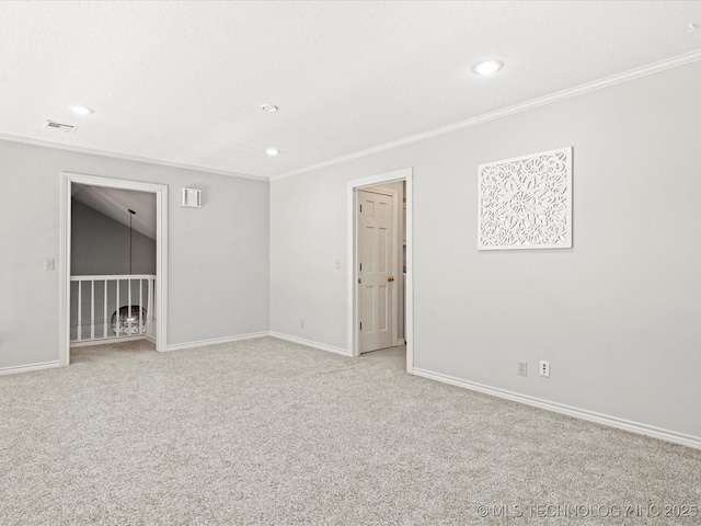 carpeted empty room with crown molding