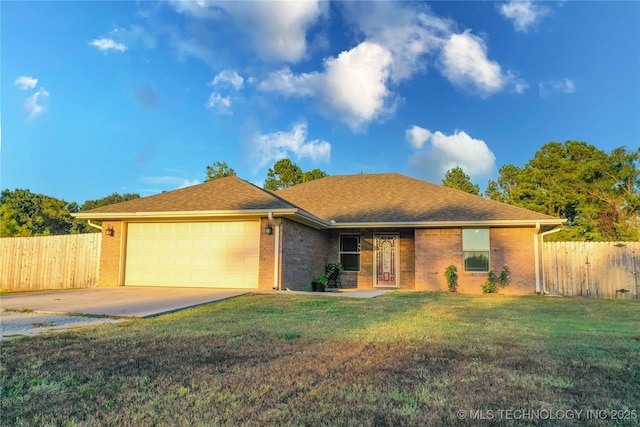 single story home with a garage and a front lawn