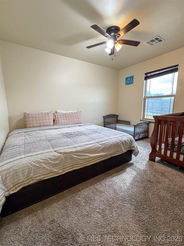 carpeted bedroom with ceiling fan