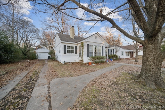 view of front of property with an outdoor structure and a garage