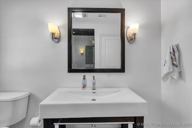 bathroom featuring sink and toilet