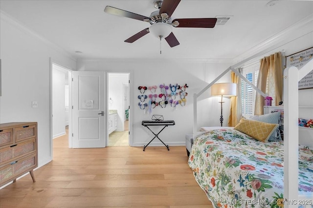 bedroom featuring ceiling fan, connected bathroom, light wood-type flooring, and ornamental molding