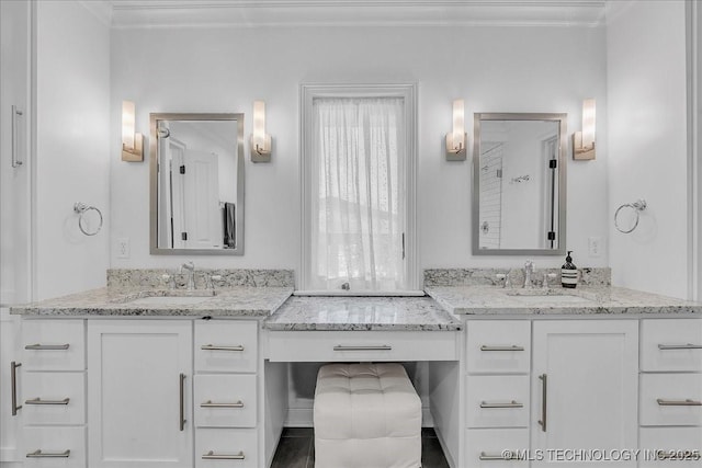 bathroom featuring vanity and ornamental molding