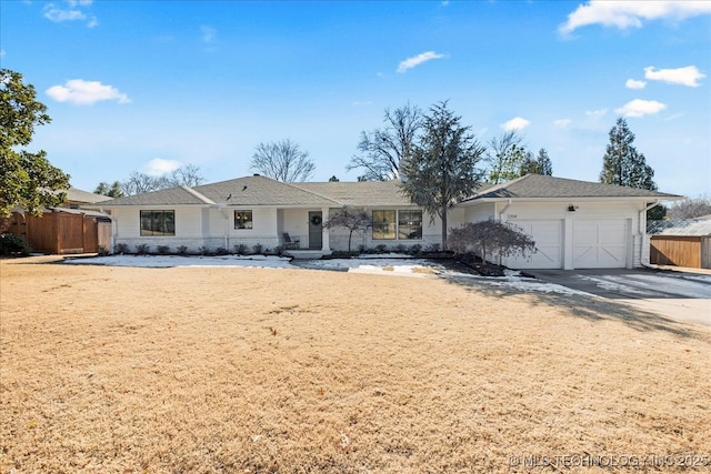 ranch-style home featuring a garage