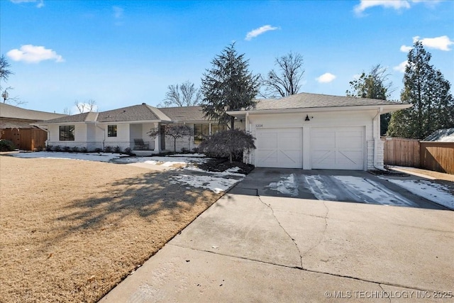 ranch-style home featuring a front yard and a garage