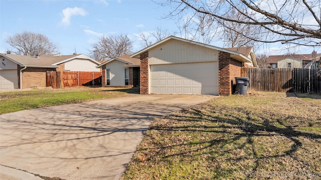 view of front facade featuring a front yard and a garage