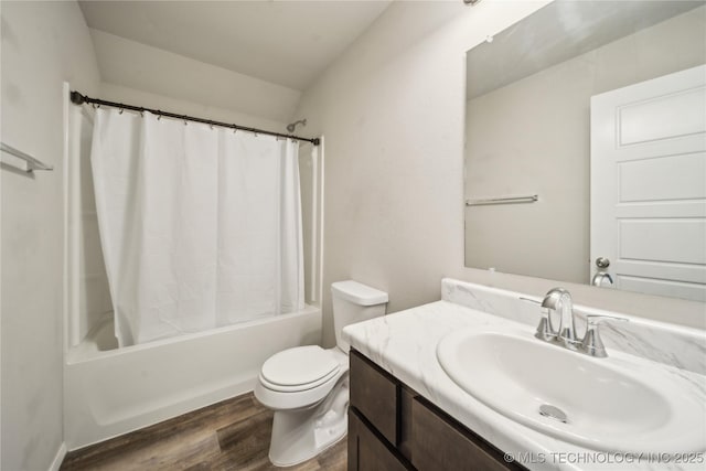 full bathroom featuring wood-type flooring, toilet, vanity, and shower / tub combo with curtain