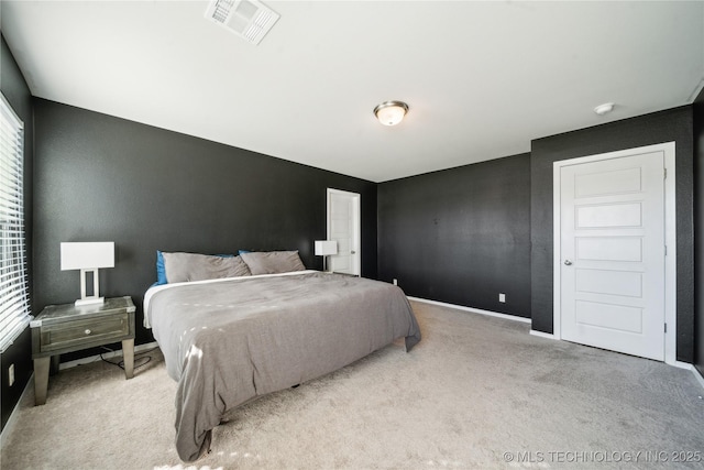 bedroom with light colored carpet