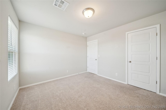 unfurnished room with carpet