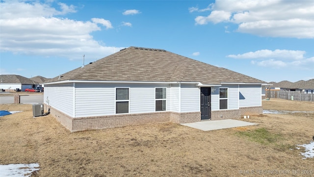 back of house with a patio and central air condition unit