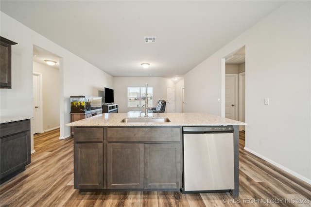 kitchen featuring sink, stainless steel dishwasher, dark hardwood / wood-style floors, and dark brown cabinets