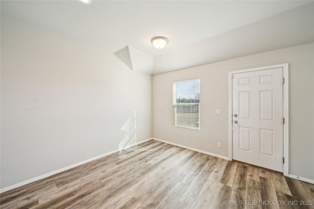 empty room with light hardwood / wood-style floors