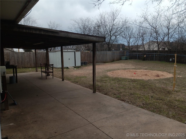 view of yard with a storage unit and a patio