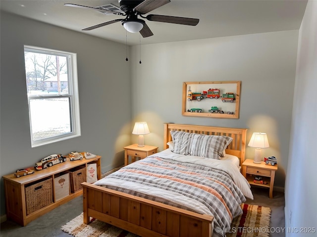 bedroom with ceiling fan and carpet flooring