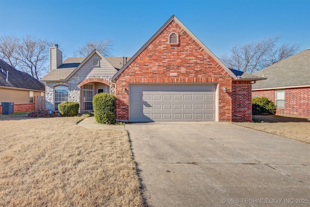 view of front facade with a garage and a front yard