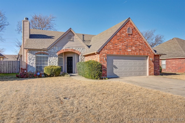 view of front of property with a garage and a front yard