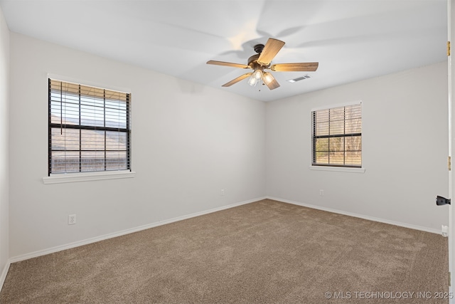 carpeted empty room featuring ceiling fan