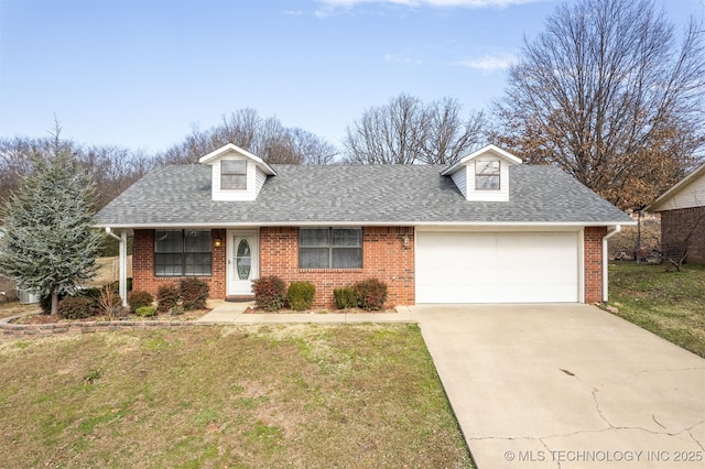 view of property featuring a garage and a front yard