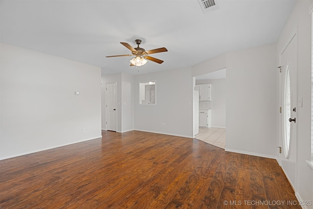 empty room featuring ceiling fan and light wood-type flooring