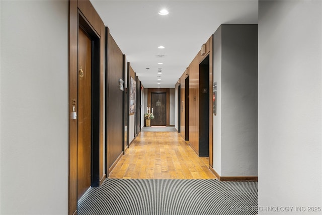 hallway with light wood-type flooring