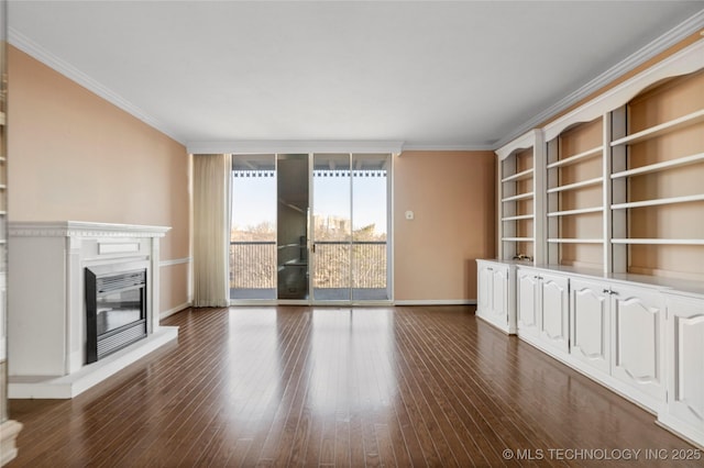 unfurnished living room featuring floor to ceiling windows, dark hardwood / wood-style flooring, and ornamental molding