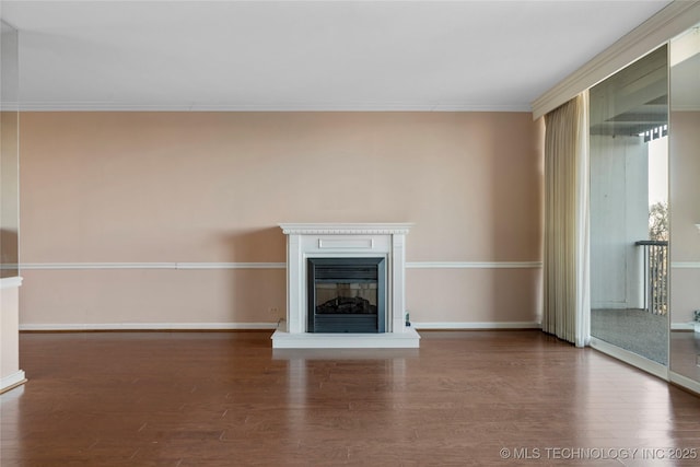 unfurnished living room featuring dark wood-type flooring and crown molding