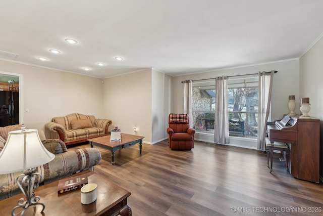 living room featuring crown molding and dark hardwood / wood-style floors