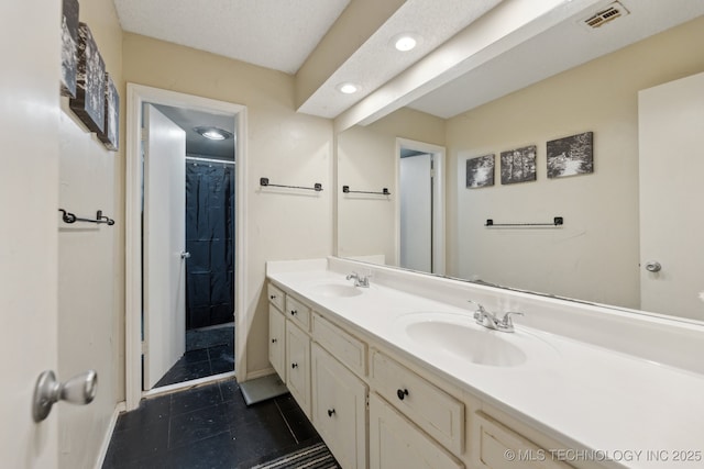 bathroom featuring vanity and a shower with curtain