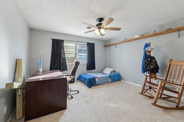 bedroom featuring ceiling fan and light carpet