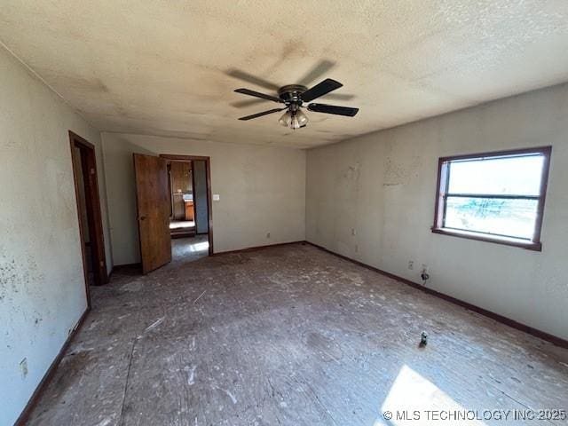 interior space with ceiling fan