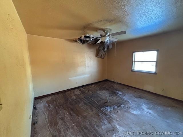 empty room with a textured ceiling