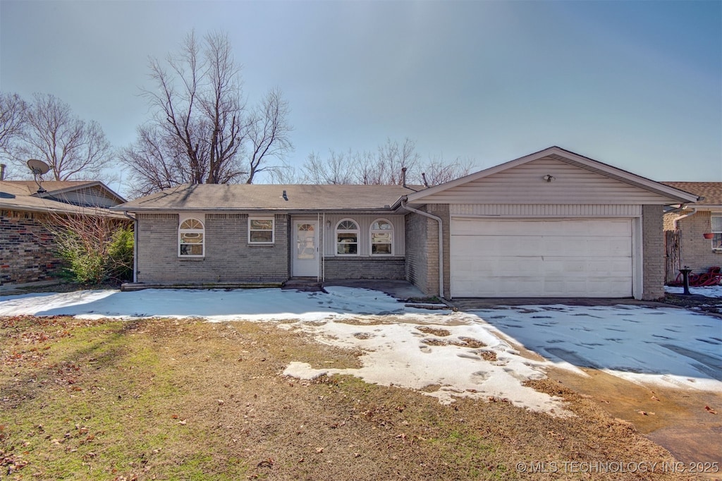 ranch-style house featuring a garage