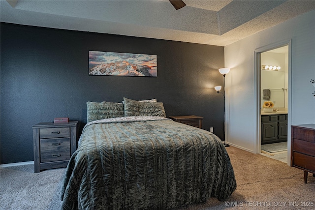 carpeted bedroom featuring ceiling fan and connected bathroom