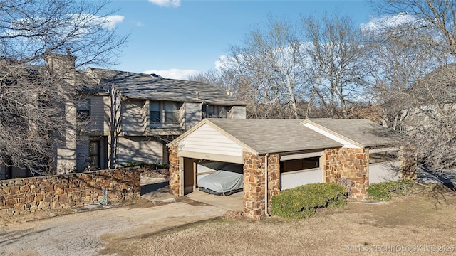 view of property exterior featuring a carport and a garage