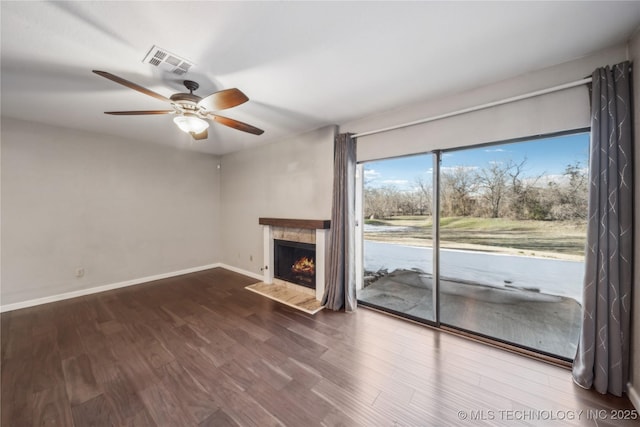 unfurnished living room with ceiling fan and hardwood / wood-style floors