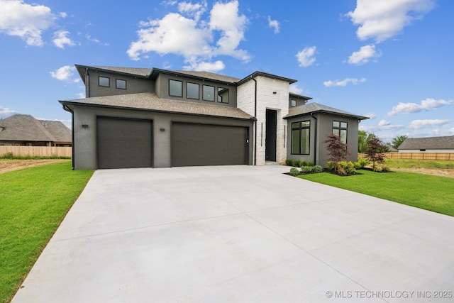 prairie-style house with a garage and a front yard