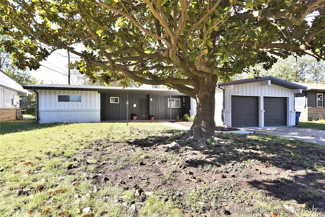 ranch-style house with a front yard and a garage