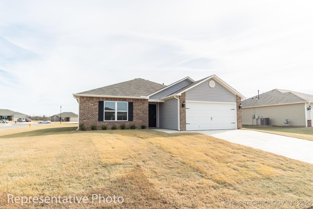 single story home with a garage and a front yard