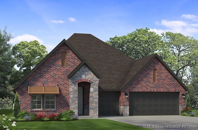 view of front of house with a garage and a front yard