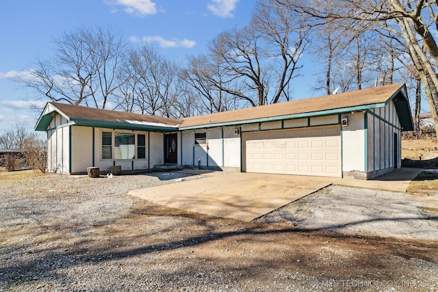 view of front of home featuring concrete driveway and a garage