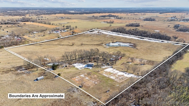 birds eye view of property featuring a rural view