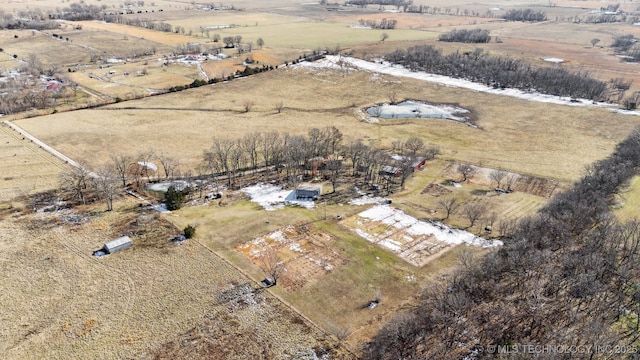 birds eye view of property featuring a rural view